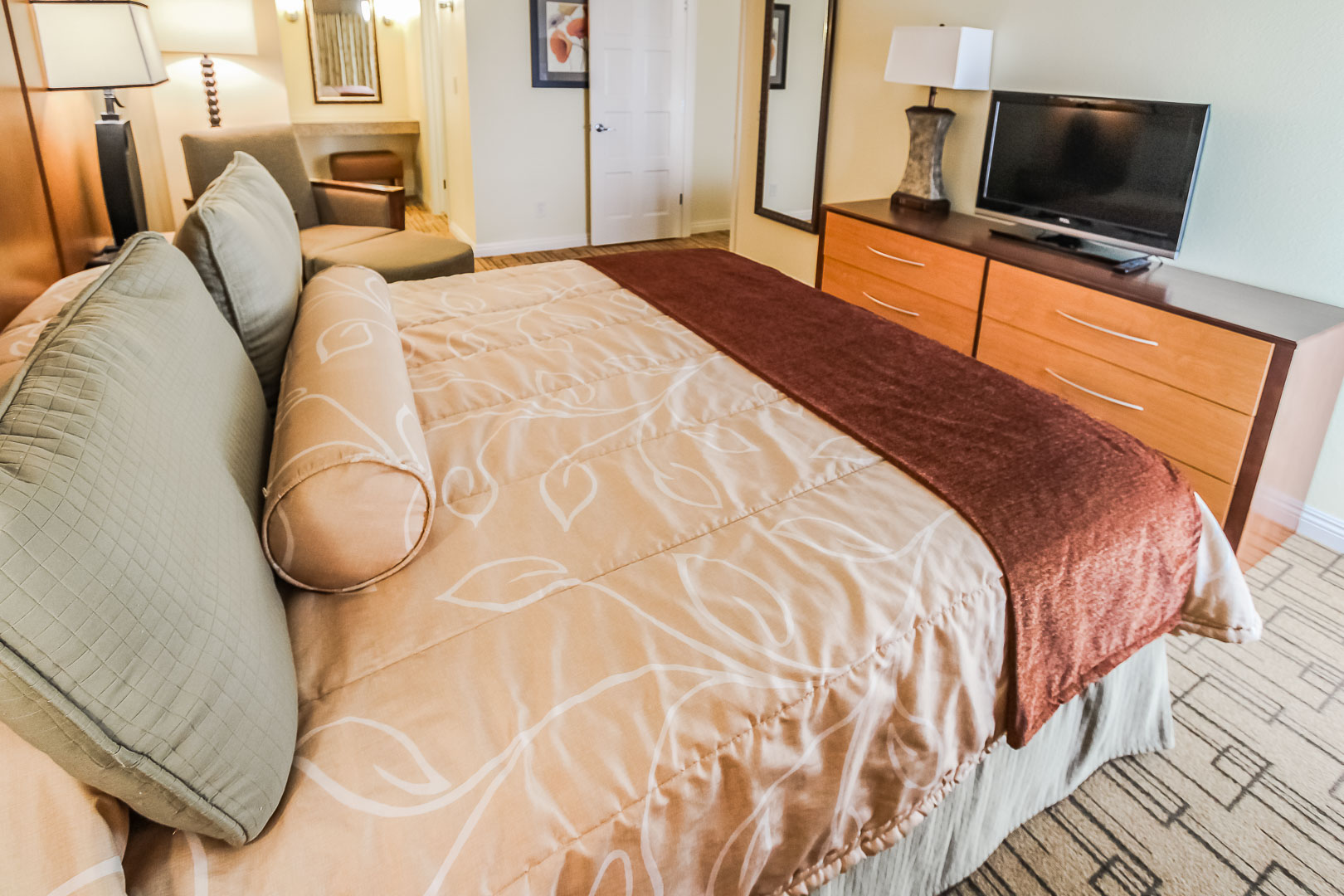 A spacious master bedroom at VRI's Winner Circle Resort in California.